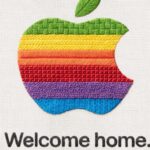A graphic showing the Apple logo embroidered in rainbow colors above the words, "welcome home."